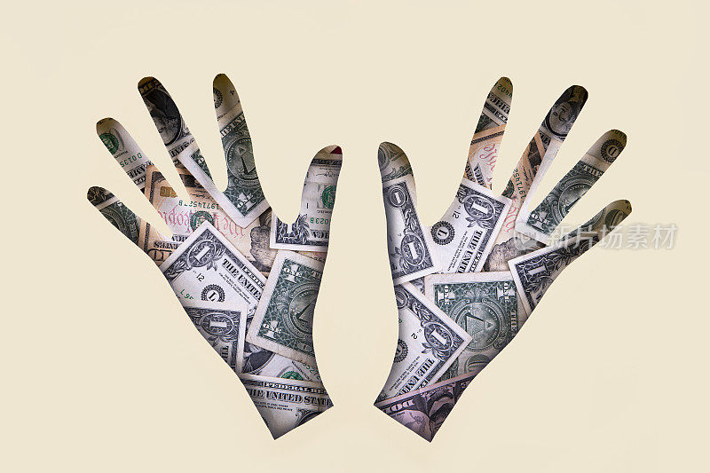 Hands made of paper and American Dollar Banknotes